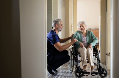 home care with care giver and user in wheel chair
