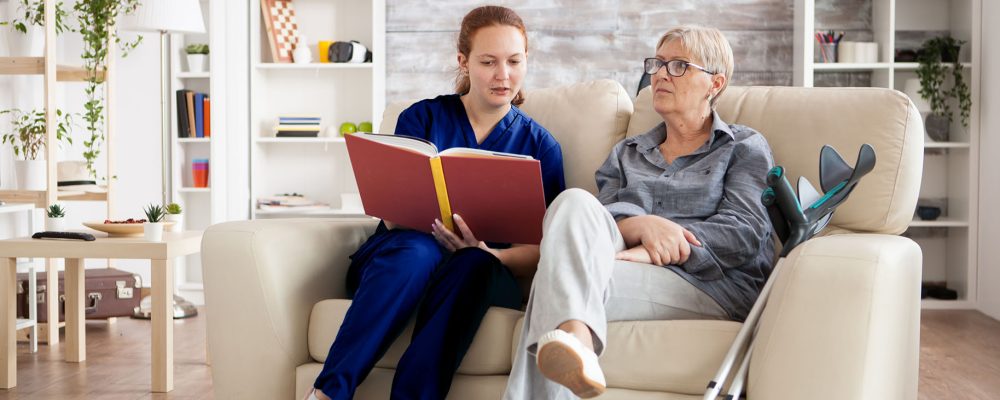 home care service of a carer with an elderly woman